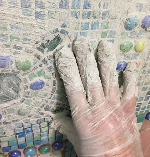 grout with glove